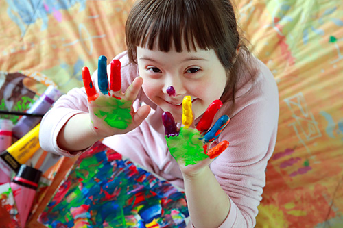 Young man with disability smiling at camera